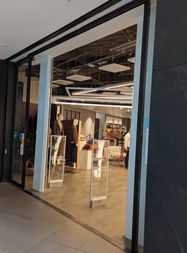 Commercial air curtain installation at John Lewis Edinburgh retail entrance showing AirDoor two-sided system