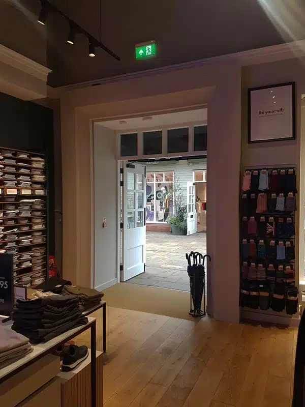 AirDoor energy-saving system installed at the entrance of Charles Tyrwhitt store in Bicester Village, Oxfordshire.